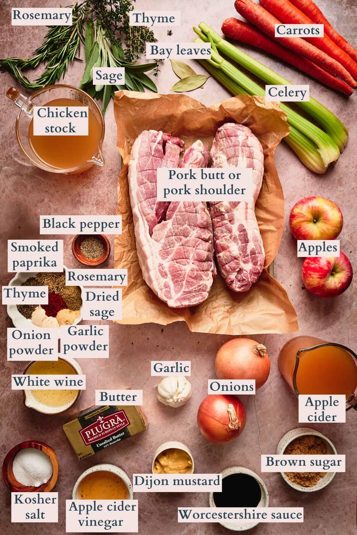 Ingredients for pulled pork laid out, fresh spices, pork butt, apple cider vinegar