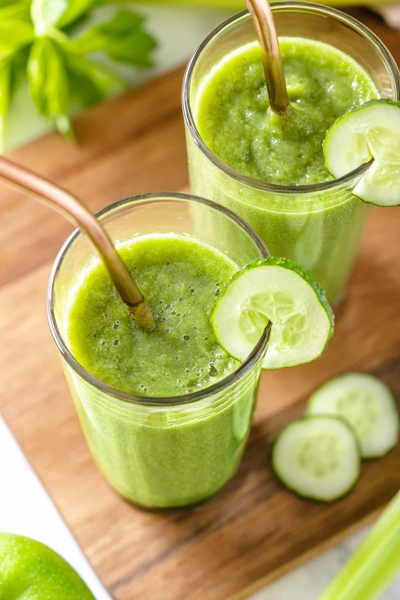 ingredients for celery cucumber smoothie on a wooden cutting board