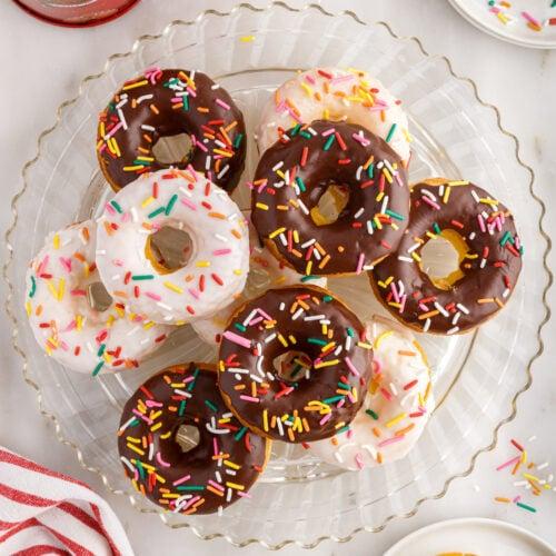 group of coffee cake donuts arranged on a plate
