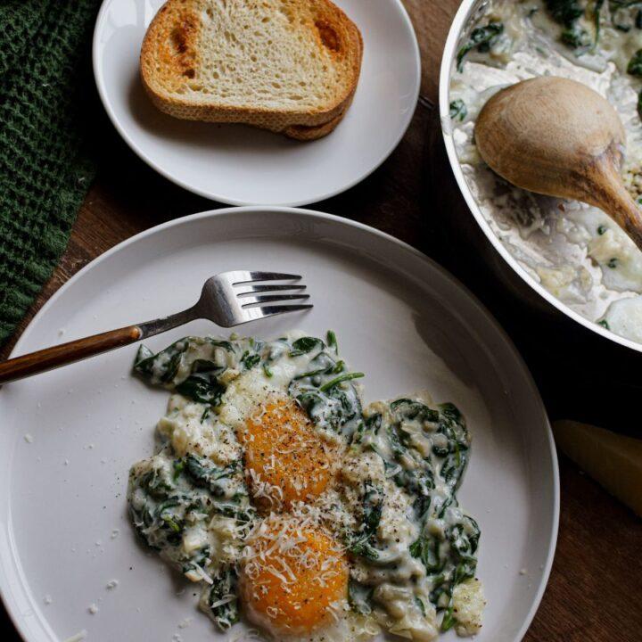 Rustic farmhouse kitchen, close up of Florentine Eggs served with crusty bread and water