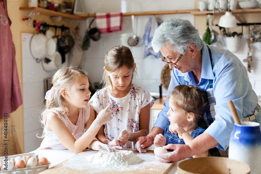 Child and grandmother baking lemon cake together in a cozy kitchen, warm lighting, emotional