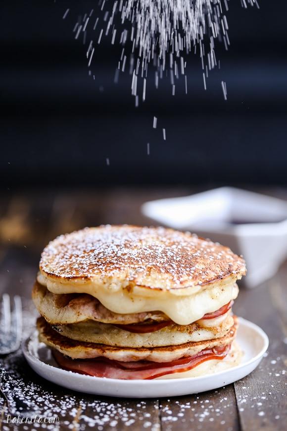 Monte Cristo Pancakes with powdered sugar and raspberry jam