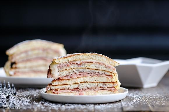 Overhead shot of Monte Cristo Pancakes on a plate with various toppings