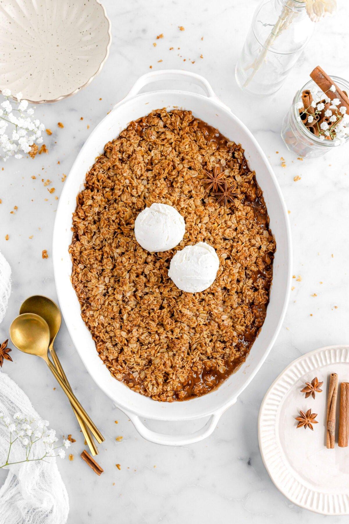 close-up shot of the apple crisp topping being sprinkled over the apples