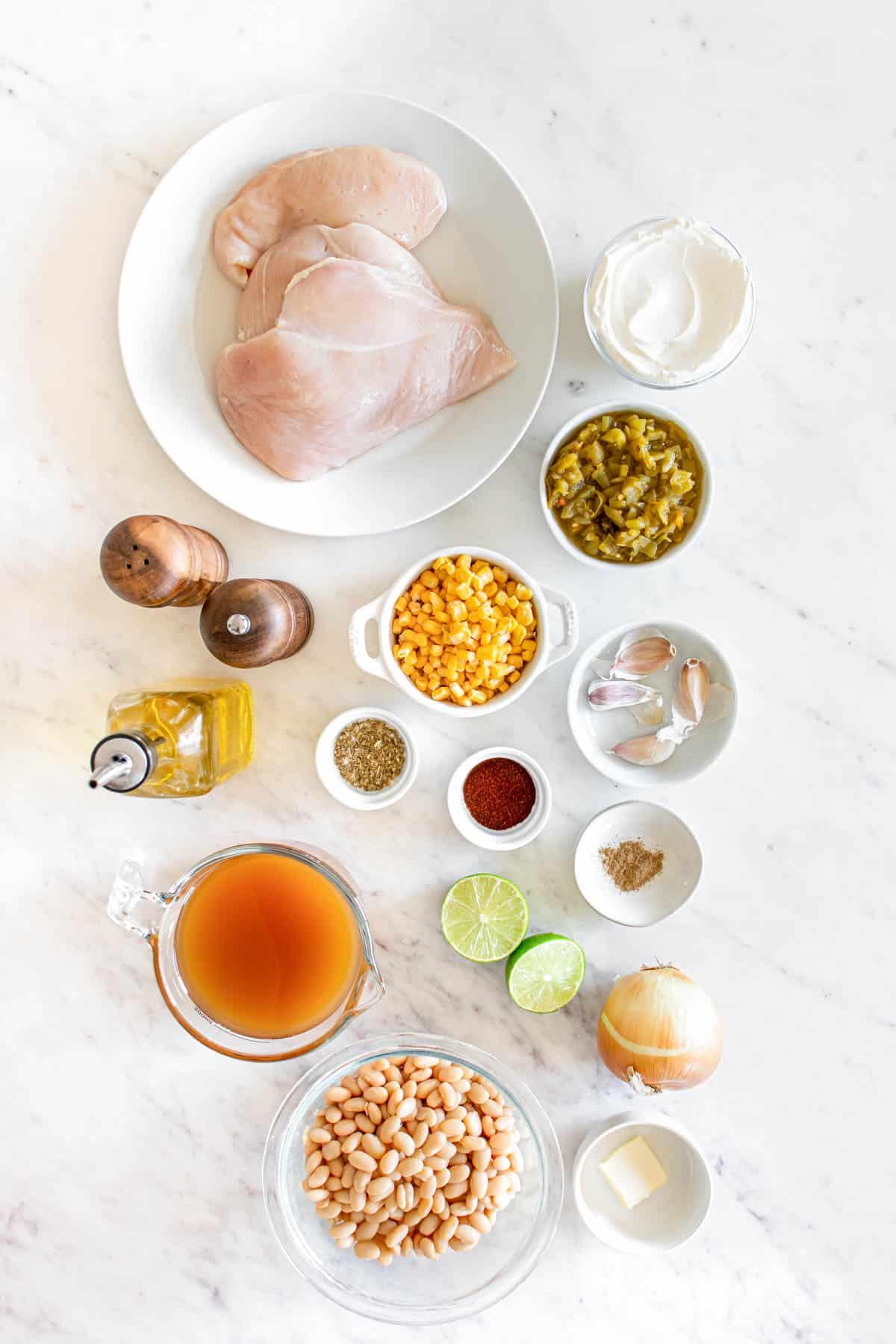 ingredients for white chicken chili laid out on a kitchen counter