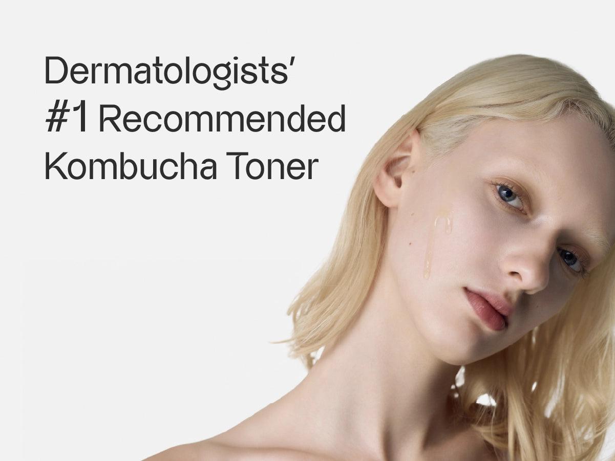 woman applying kombucha toner to her face in a bright, natural setting