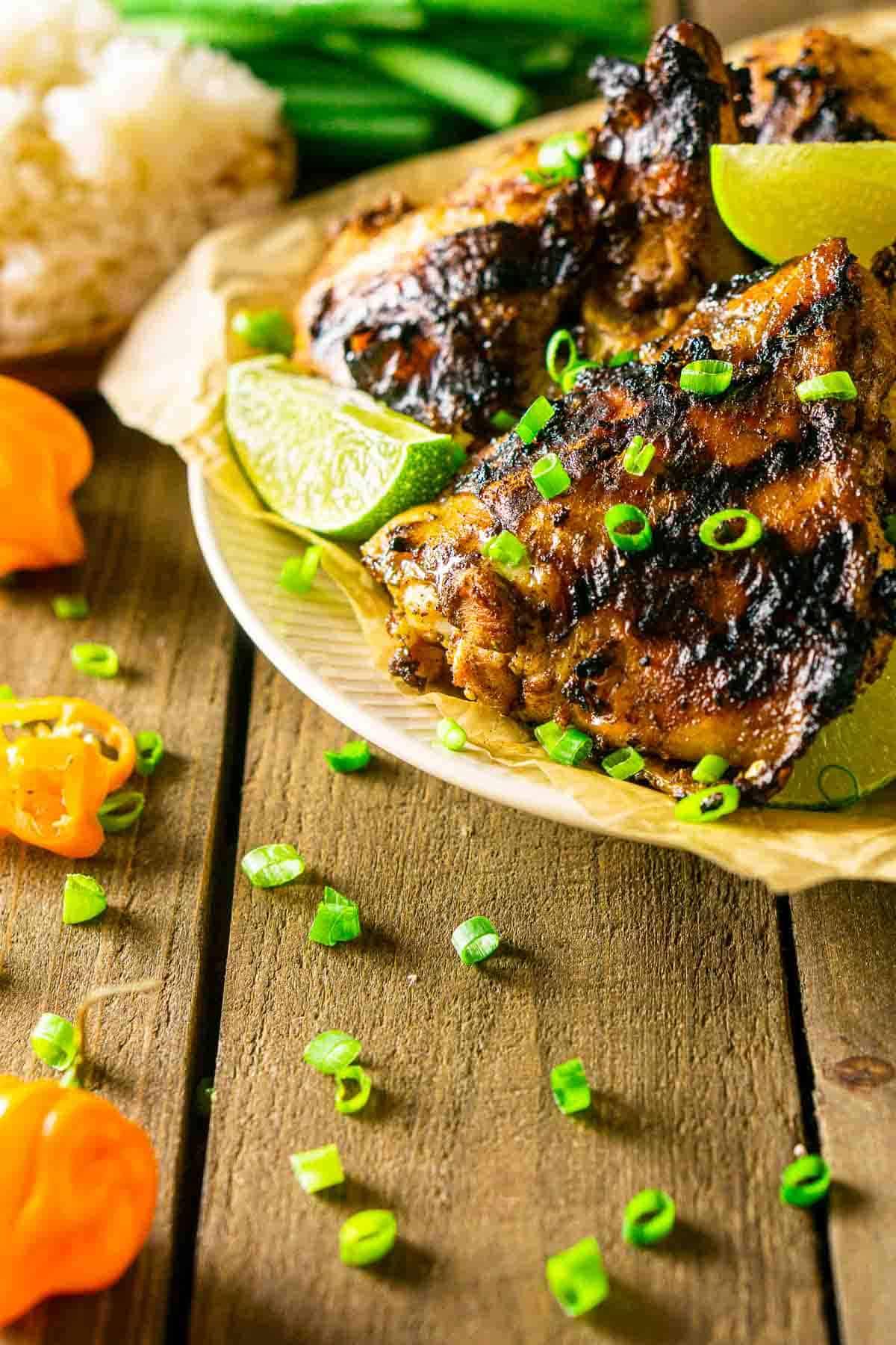 Jerk chicken with lime glaze on a grill
