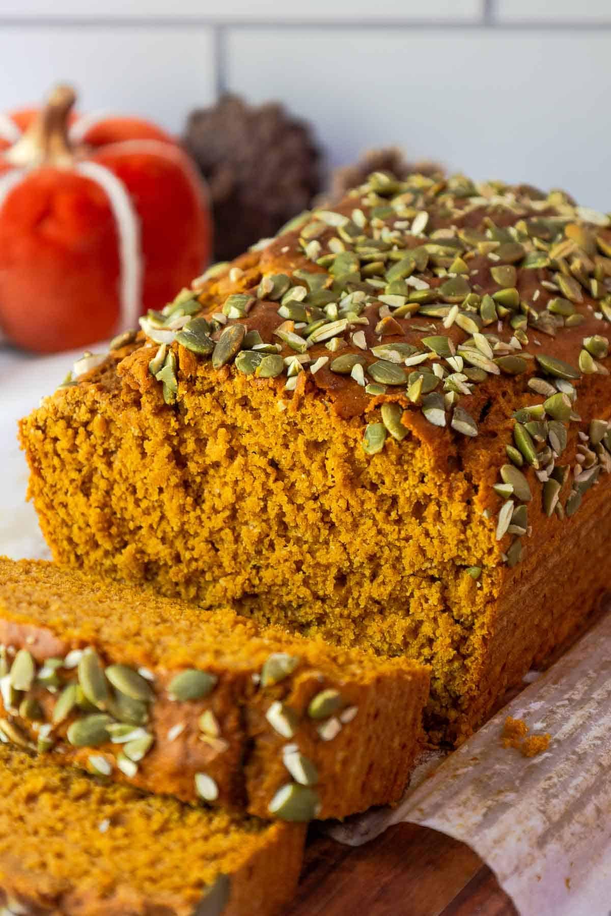 close up photo of pumpkin spice bread ingredients, including pumpkin puree and spices