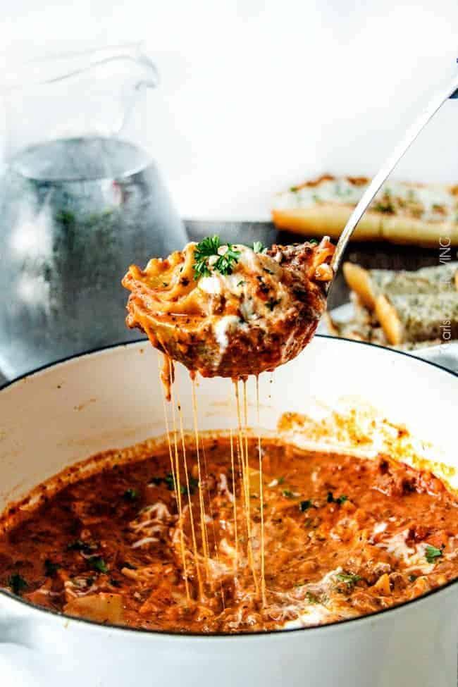 a pot of lasagna soup being served