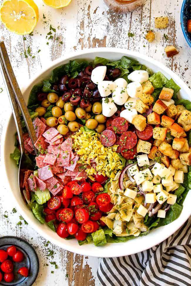 A vibrant and colorful antipasto salad with Italian dressing
