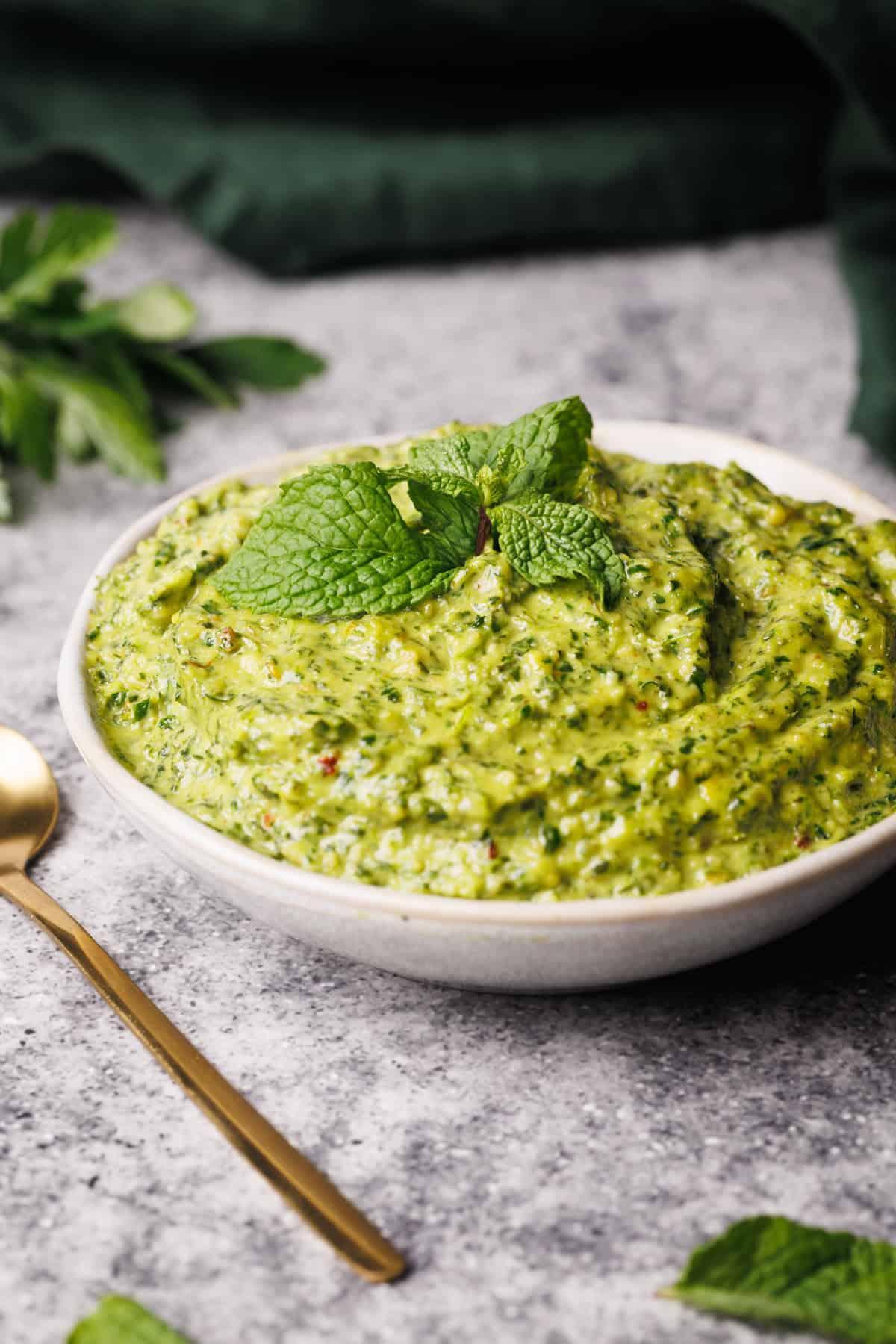 Creamy cashew cheese with vibrant green mint sauce