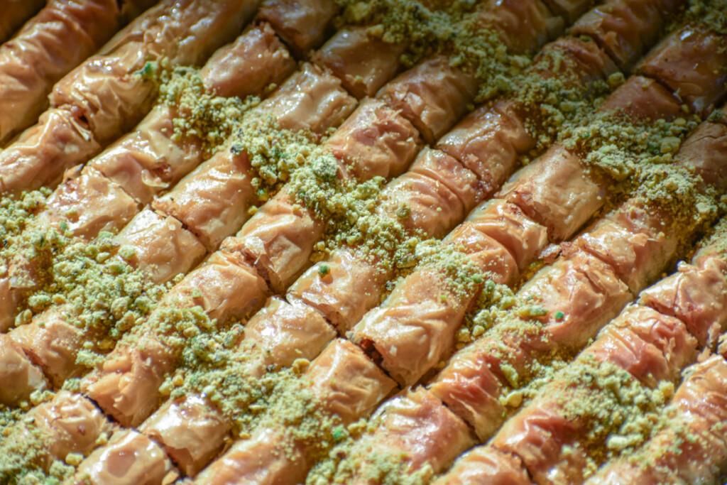 close up shot of the flaky layers of cardamom spiced baklava fingers