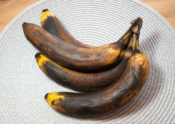 very ripe dark brown bananas on a kitchen counter