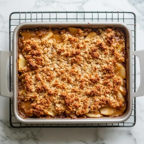 Apple crisp cooling on a wire rack