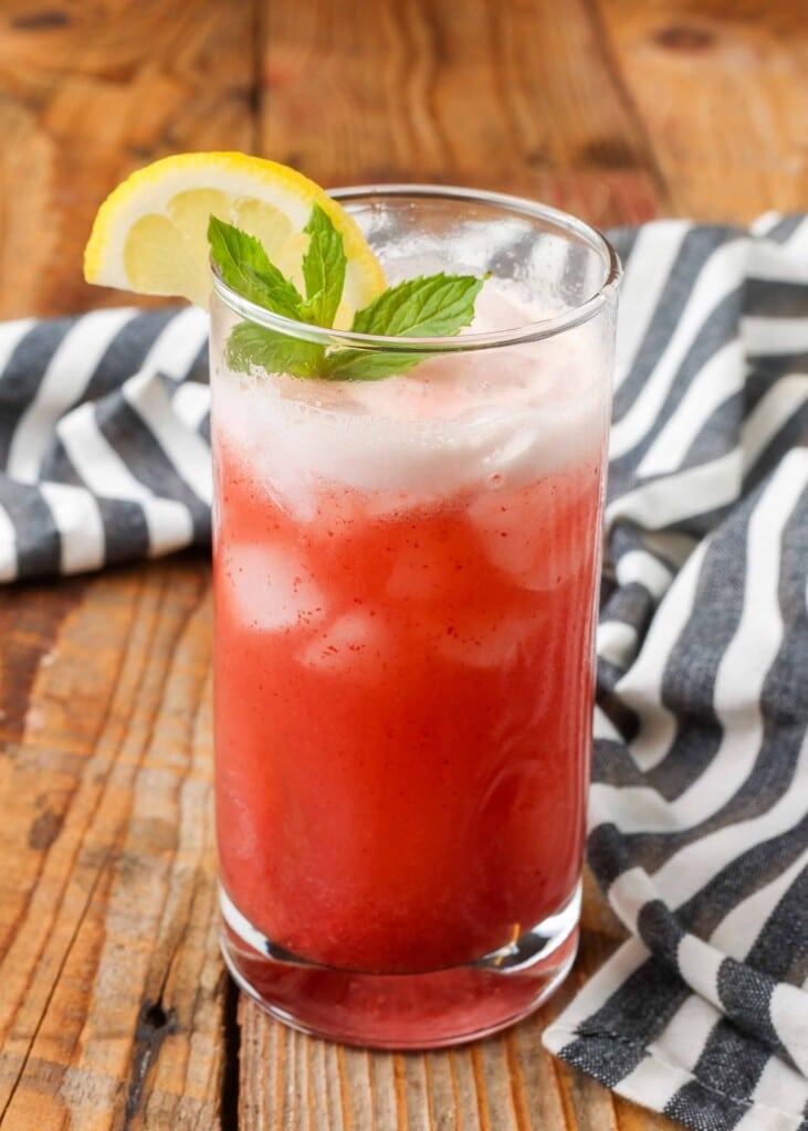 close up of cherry almond lemonade with condensation on the glass
