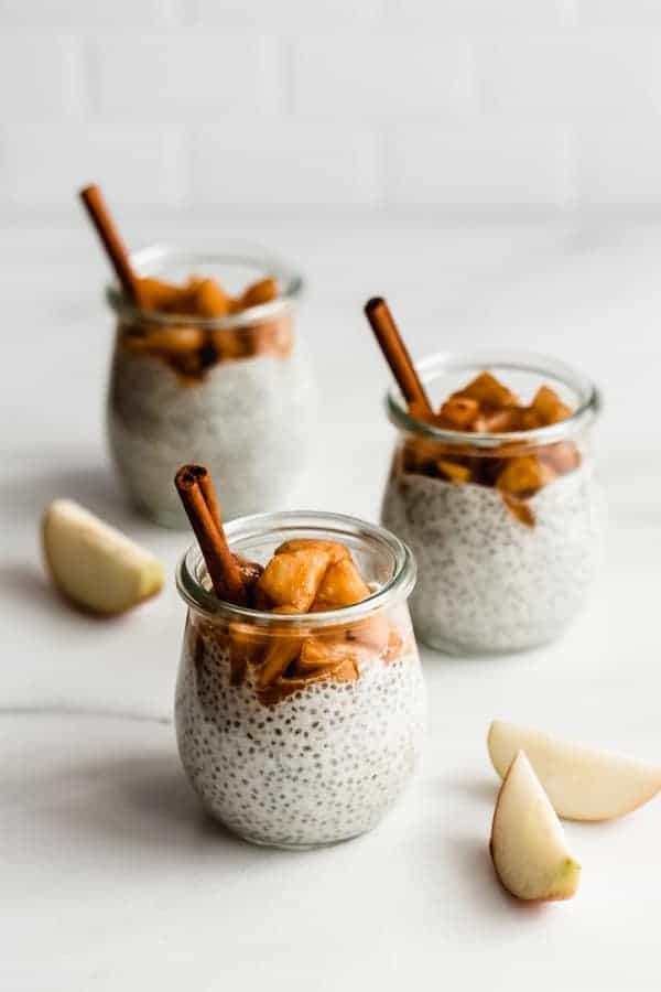 A bowl of Apple Cinnamon Chia Seed pudding with a spoon in it