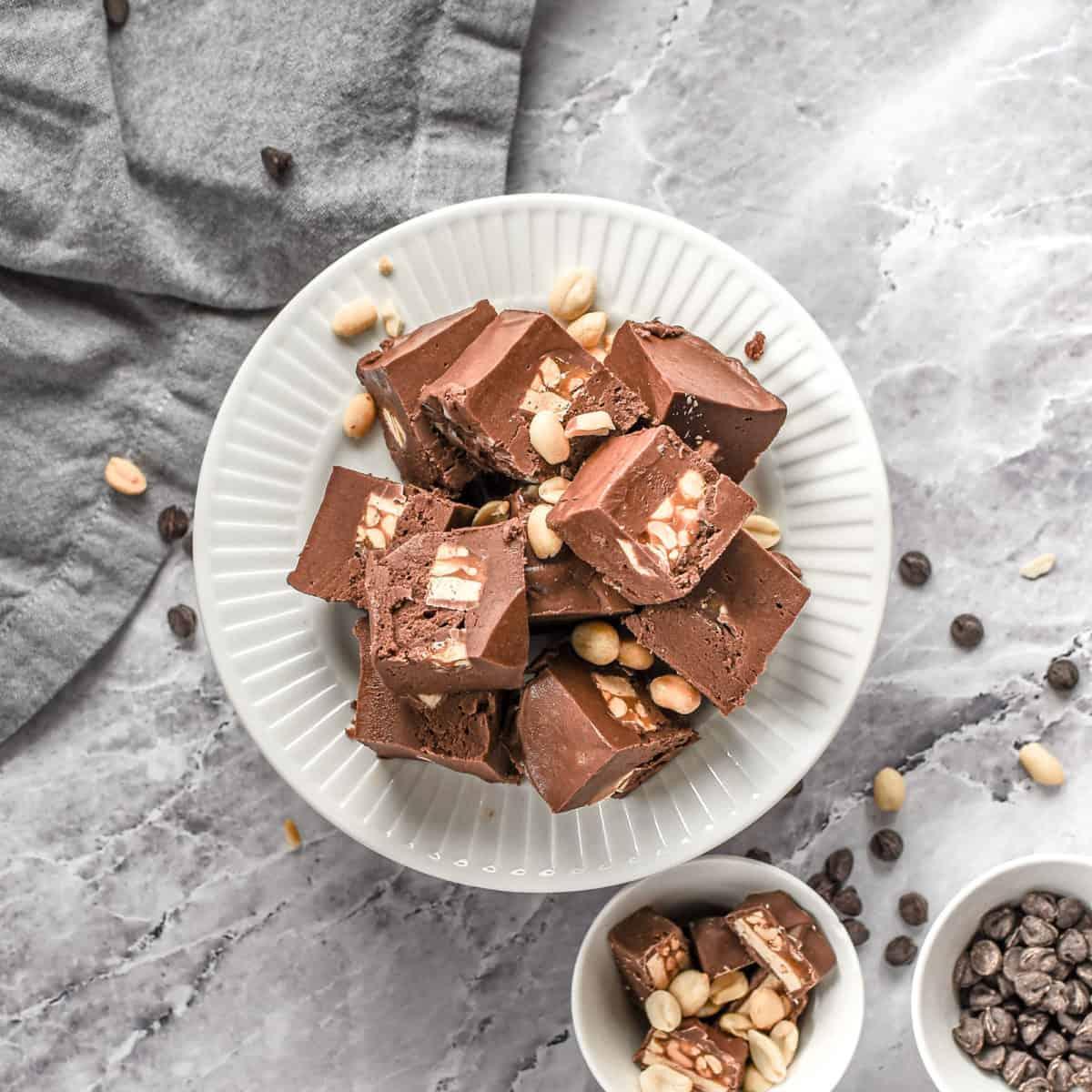 overhead shot of chocolate fudge squares arranged on a plate