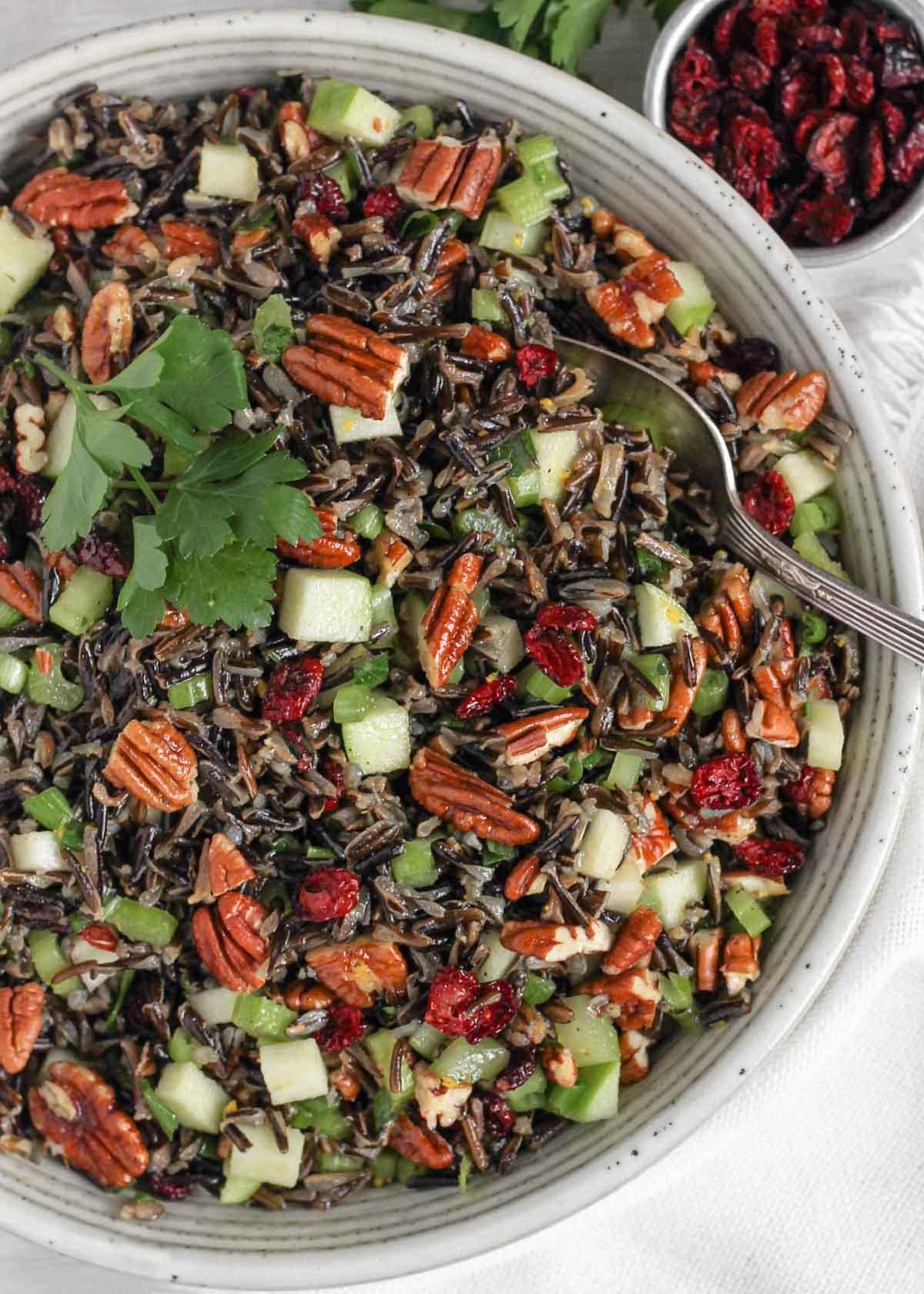 Wild Rice Salad with Dried Cranberries and Pecans served in a bowl