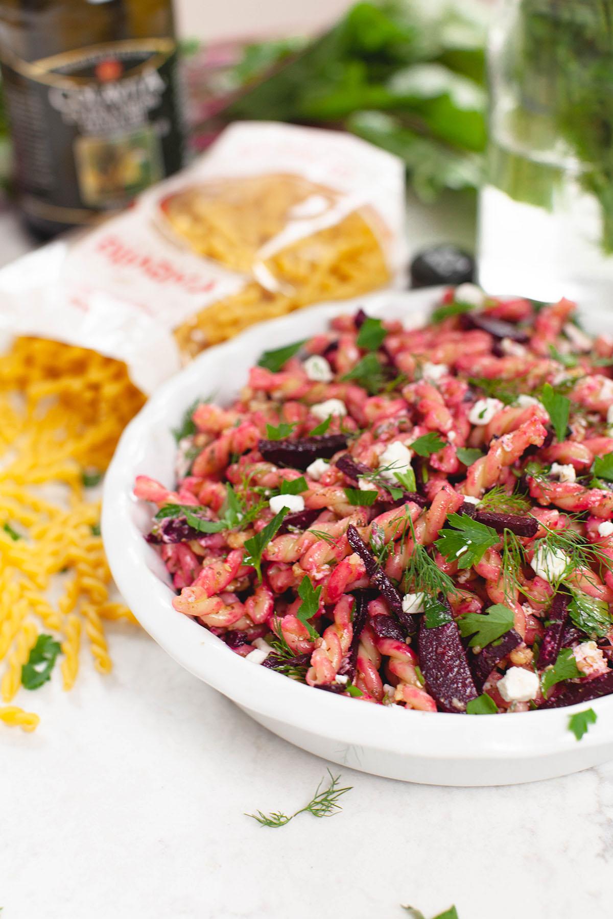 beet pasta salad in a serving dish