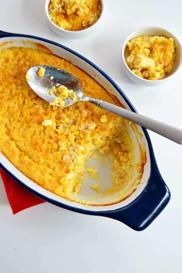 Close-up of a bubbling, golden baked corn casserole straight from the oven