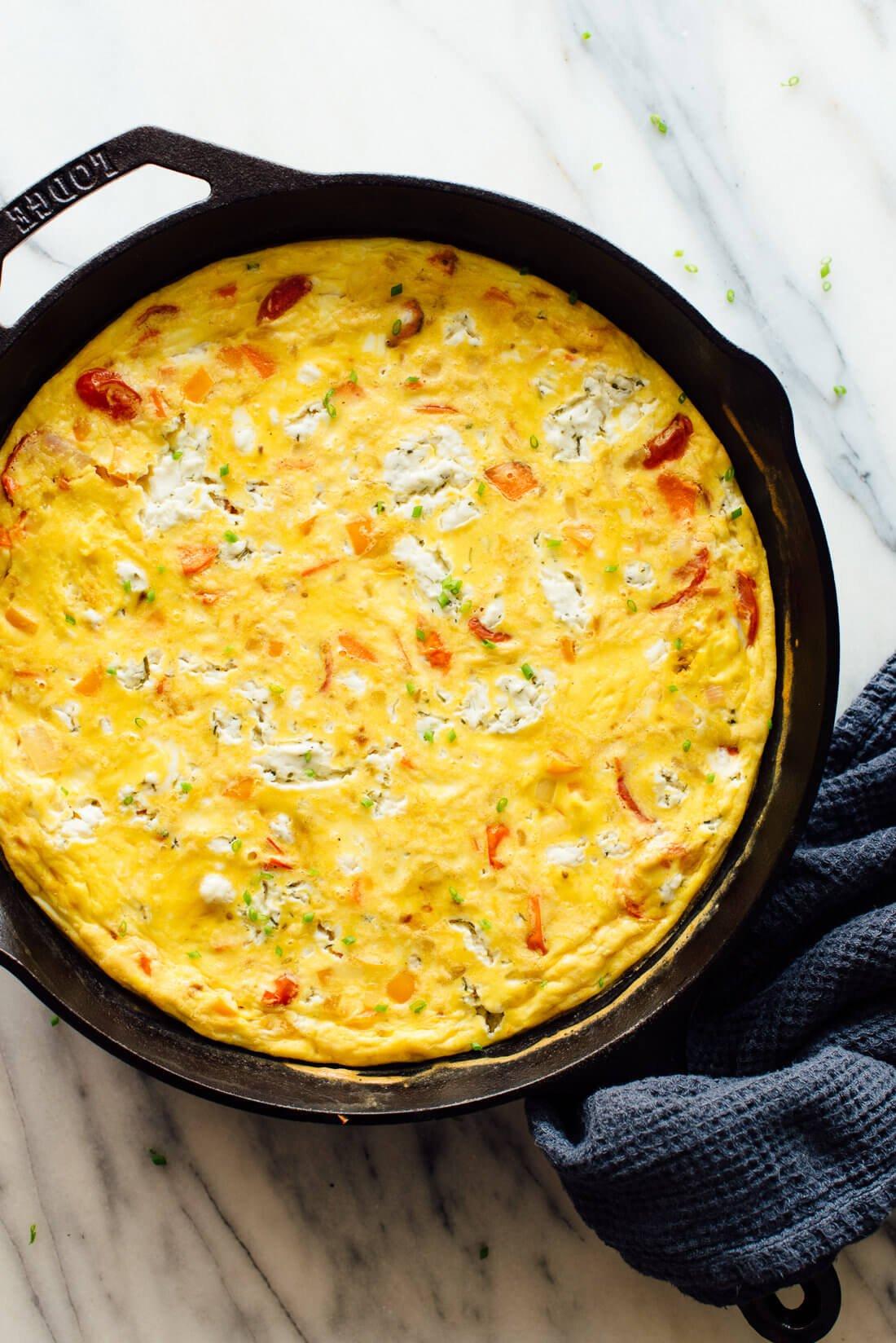 frittata being cooked in a skillet on a stove
