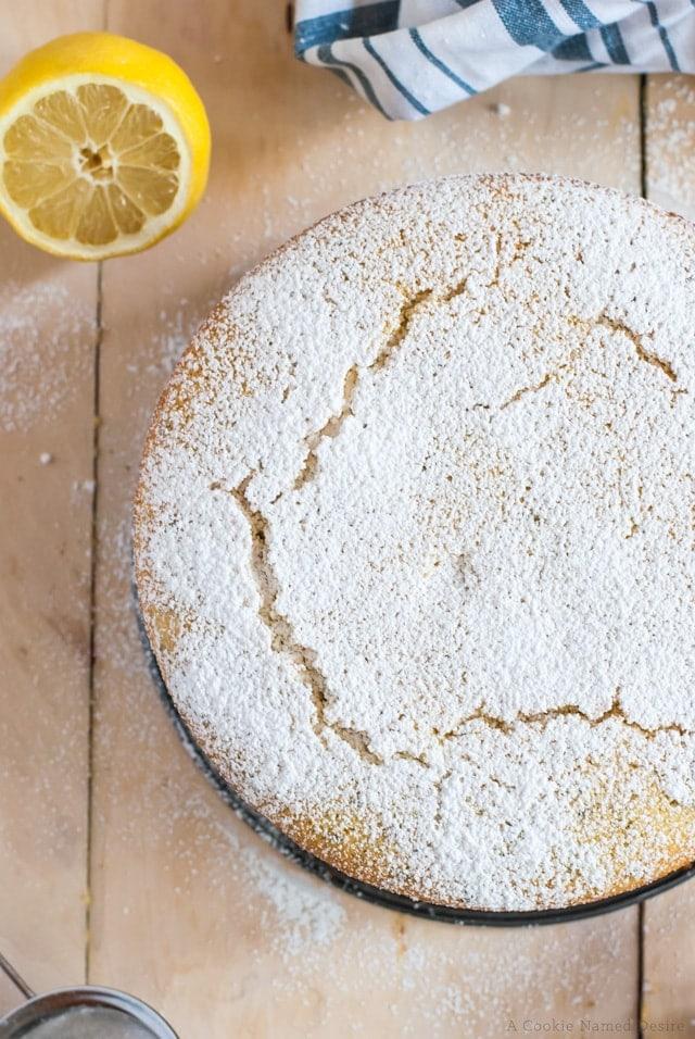 A rustic lemon and semolina cake with powdered sugar dusting