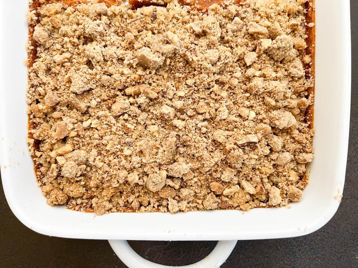 overhead shot of the baked sweet potato casserole with a golden crust, steam rising