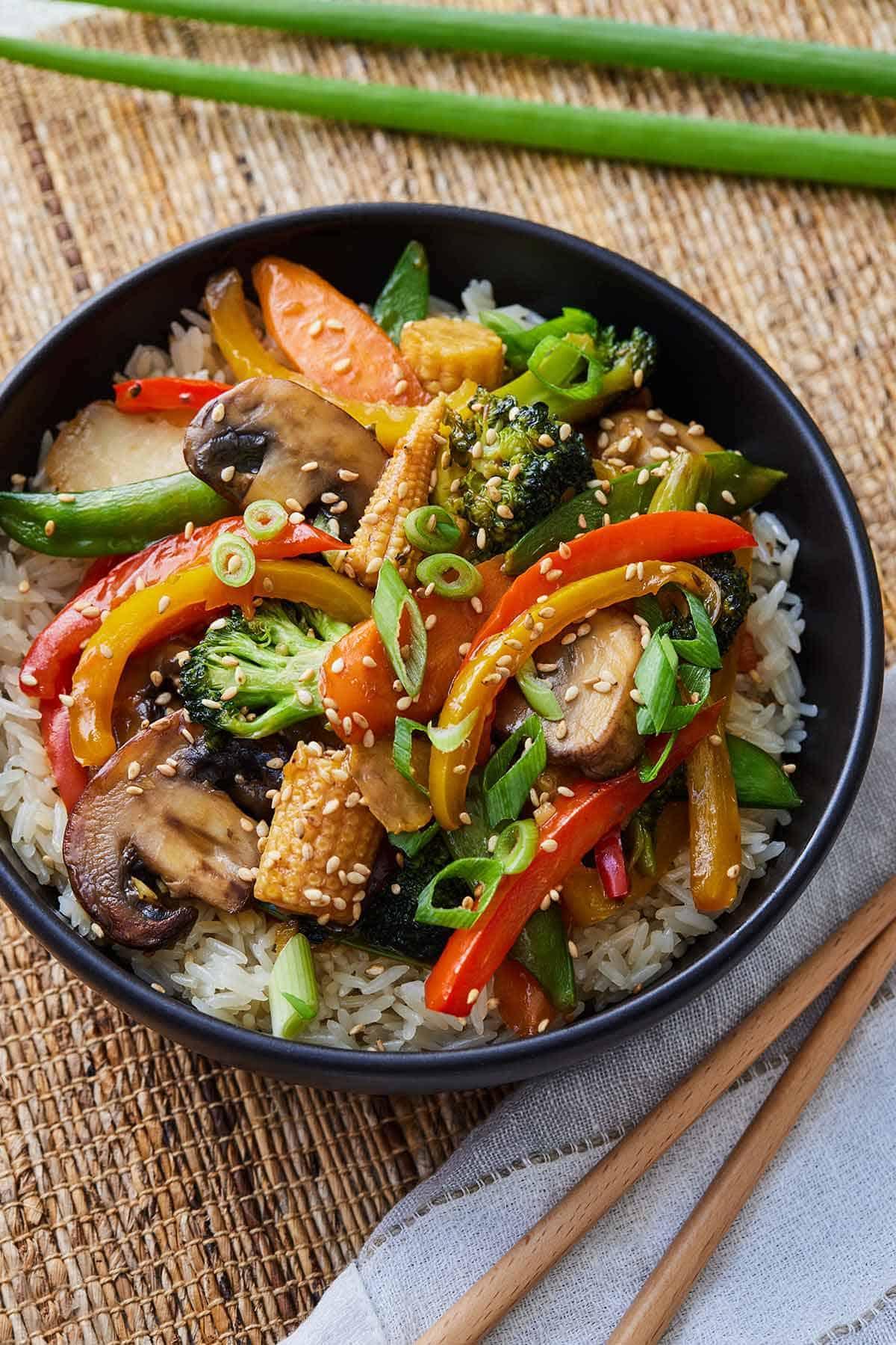 delicious and colorful vegetable stir-fry with chopsticks