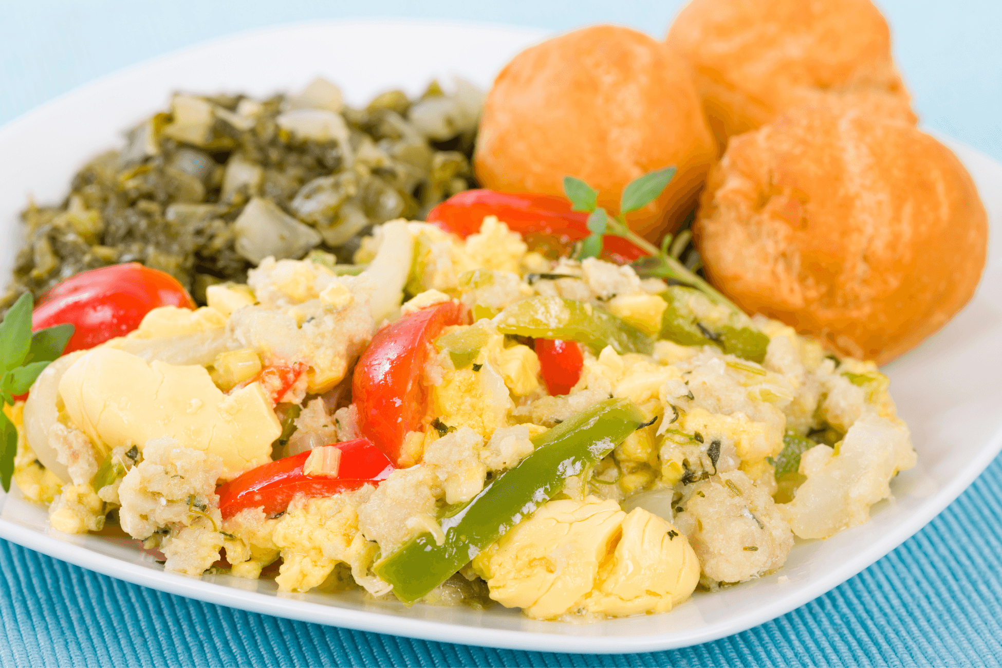 close up of a saltfish and ackee roti breakfast bowl