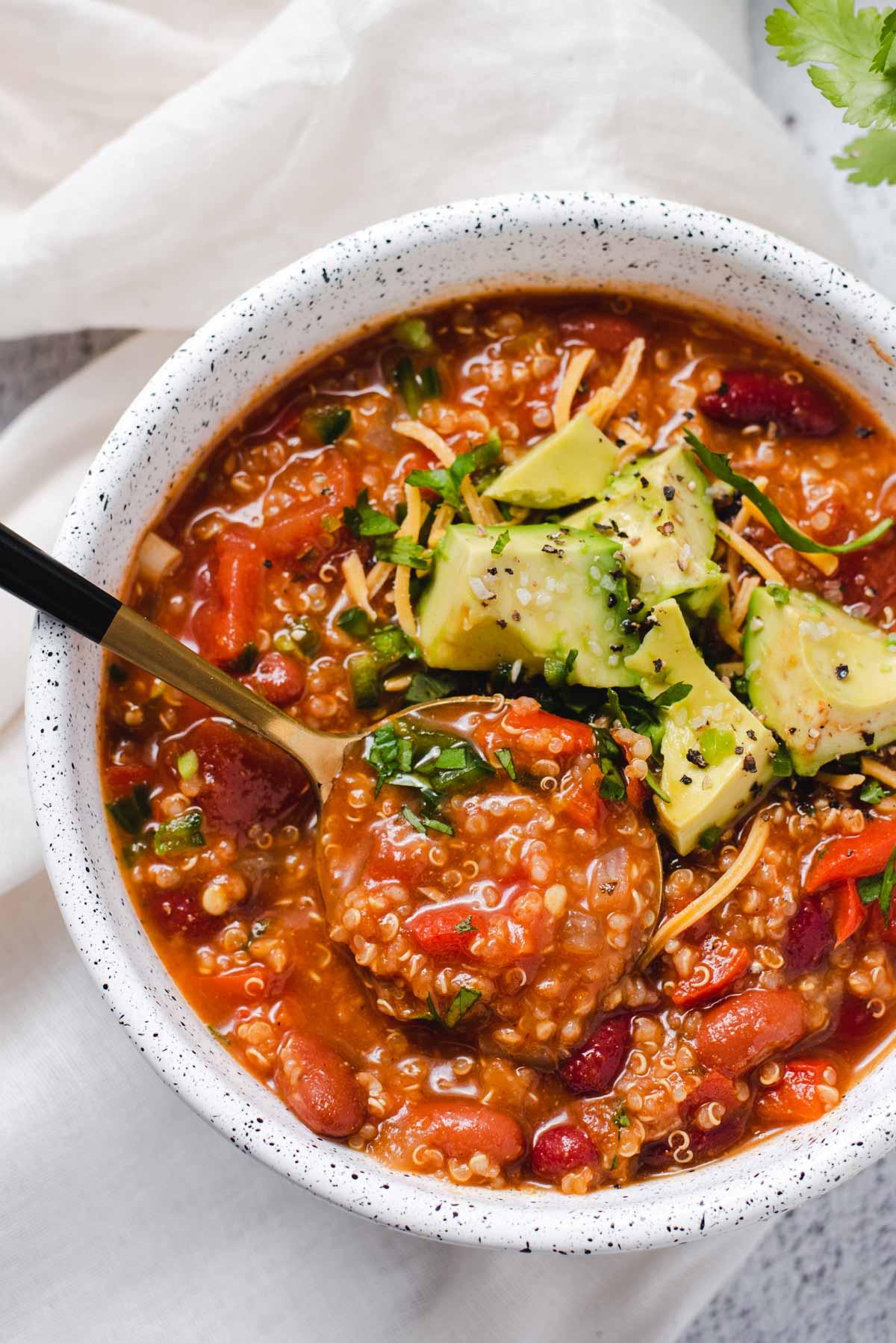 close up of a pot of quinoa chili simmering on the stove