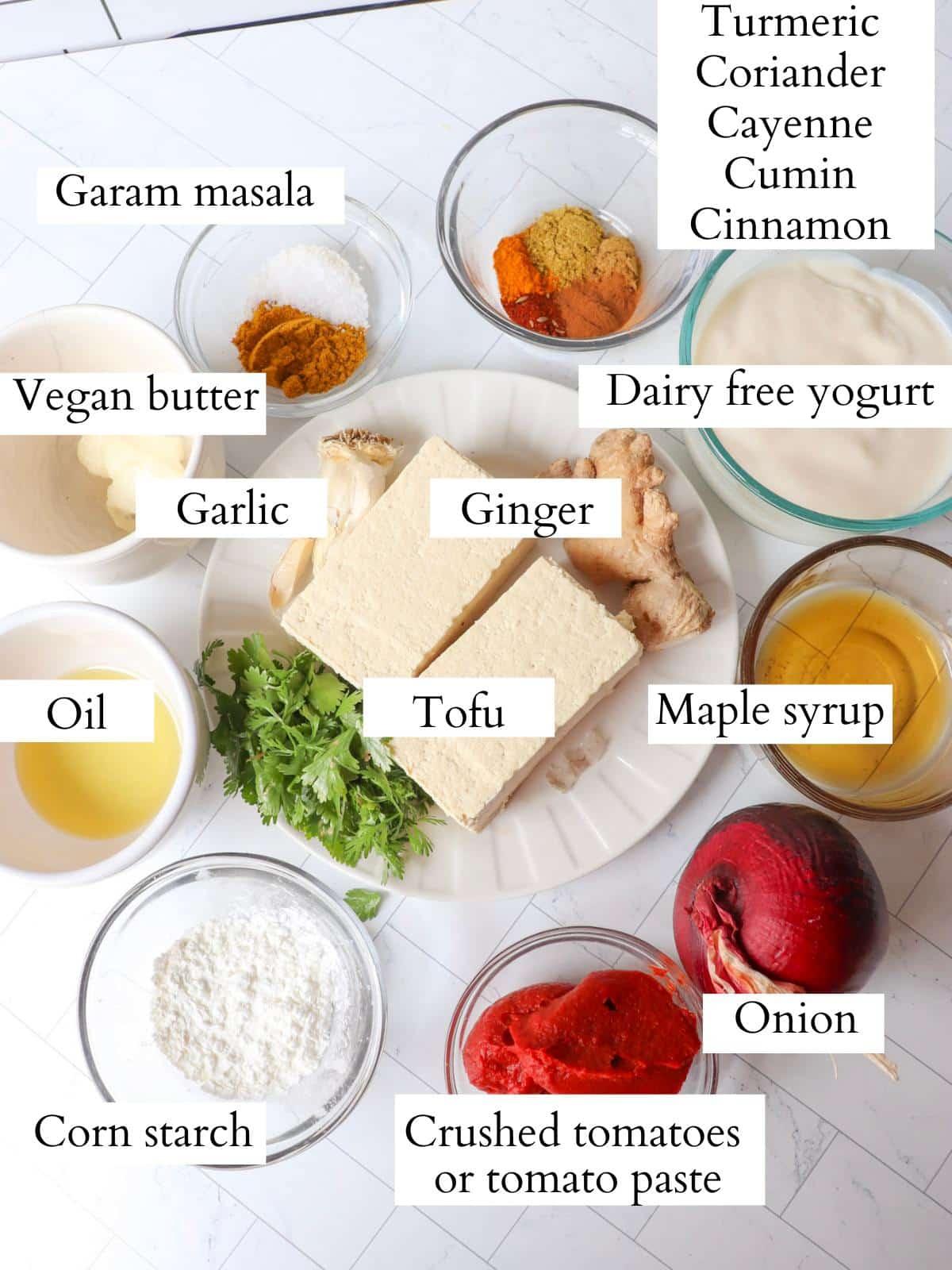 ingredients for butter chicken laid out on a kitchen counter