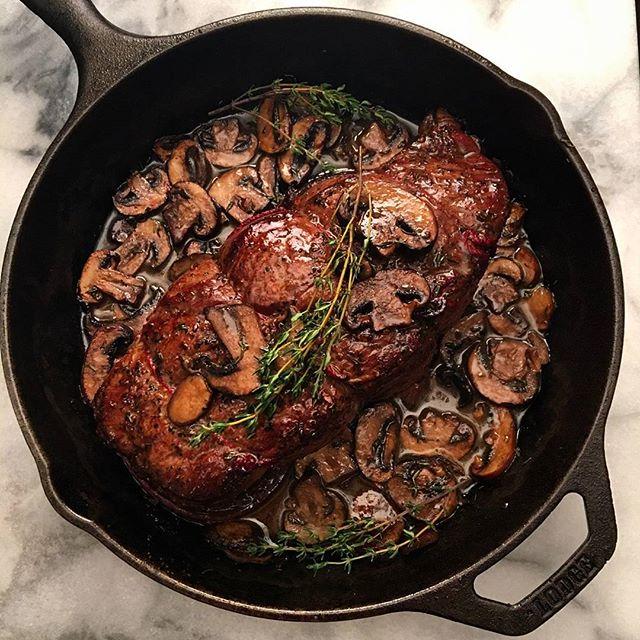 Close-up of seared beef chuck in a cast iron skillet