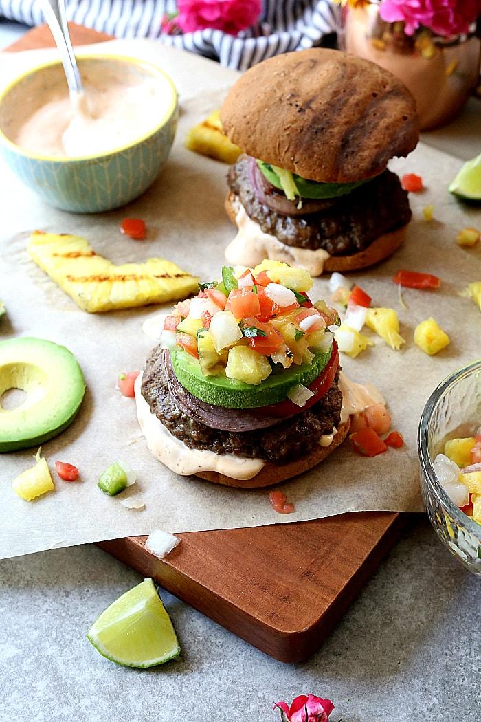 Pineapple Salsa & Avocado Burger on a wooden board