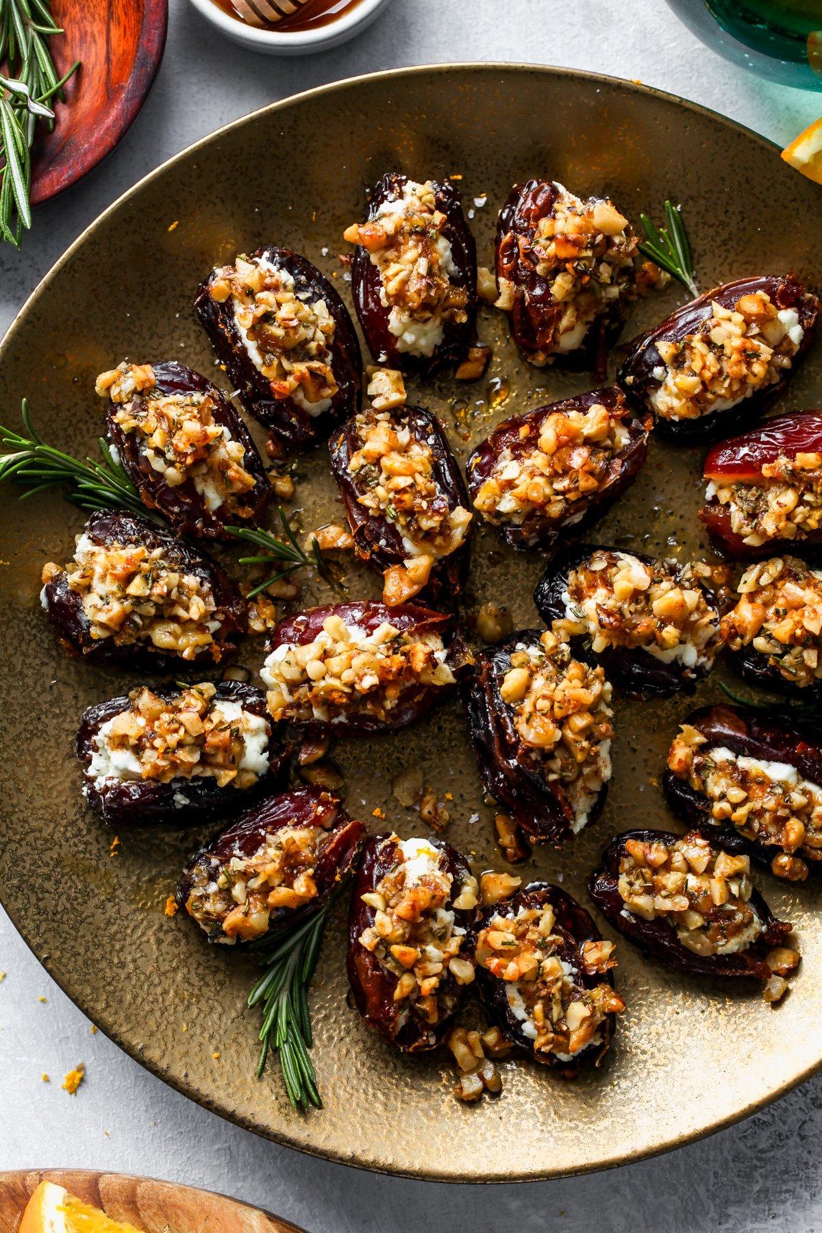 chipotle roasted almond stuffed dates on a wooden board