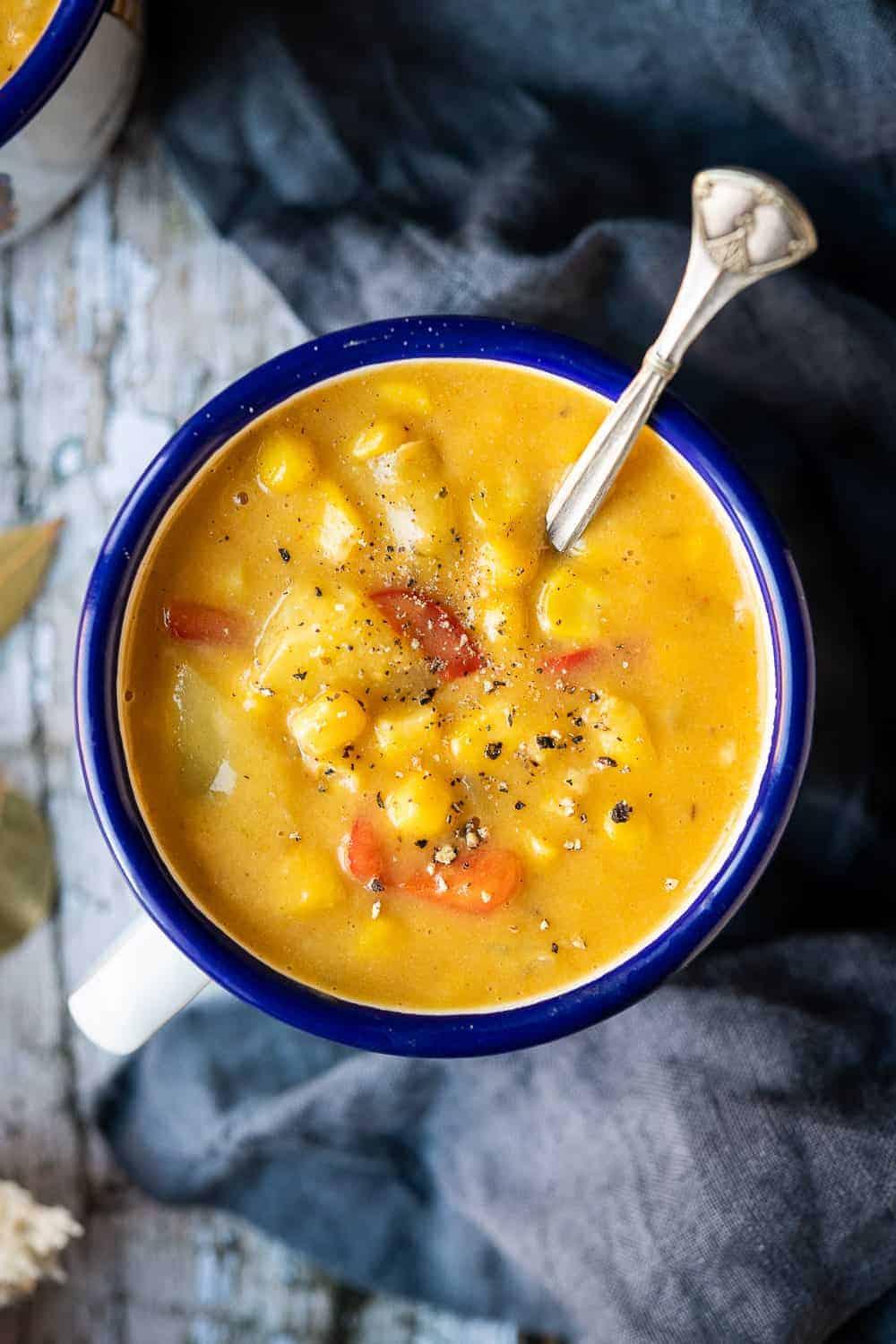 vegan corn and cheese chowder in a rustic bowl