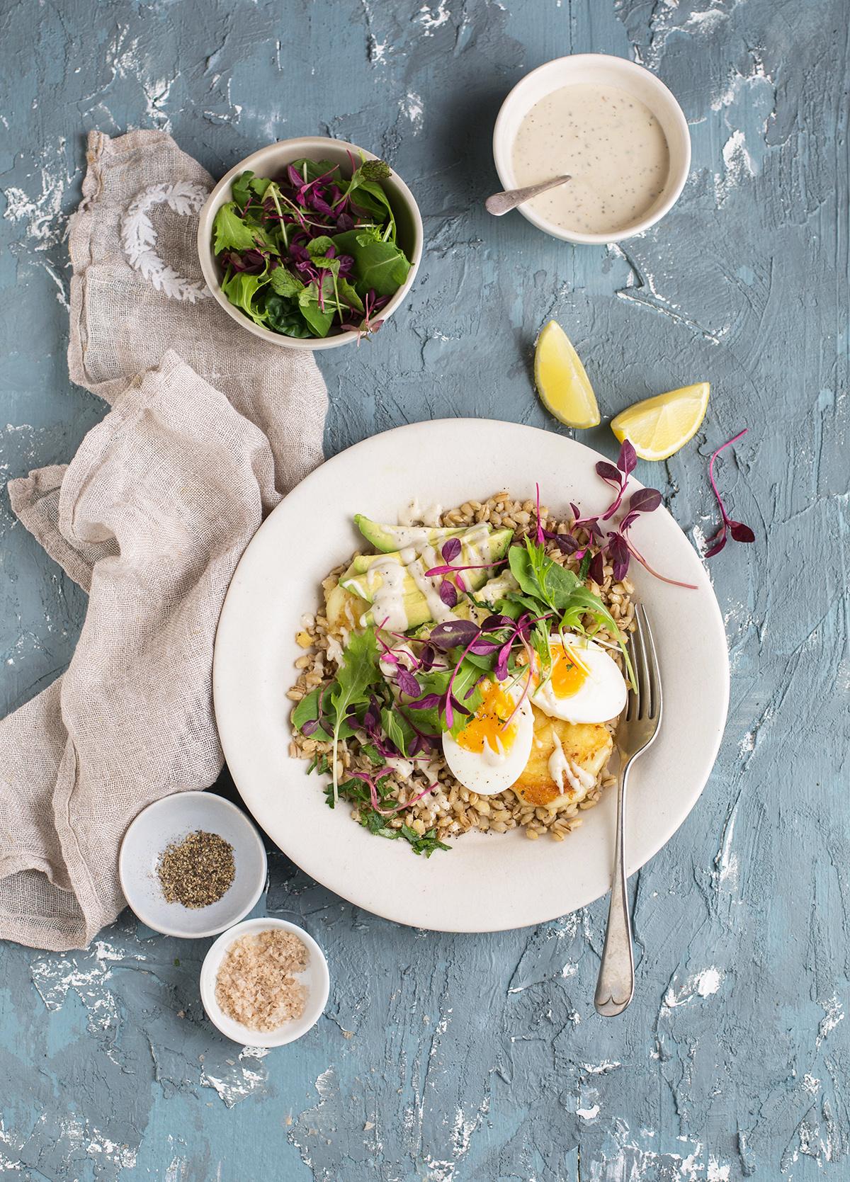 Barley bowl with avocado and a fried egg