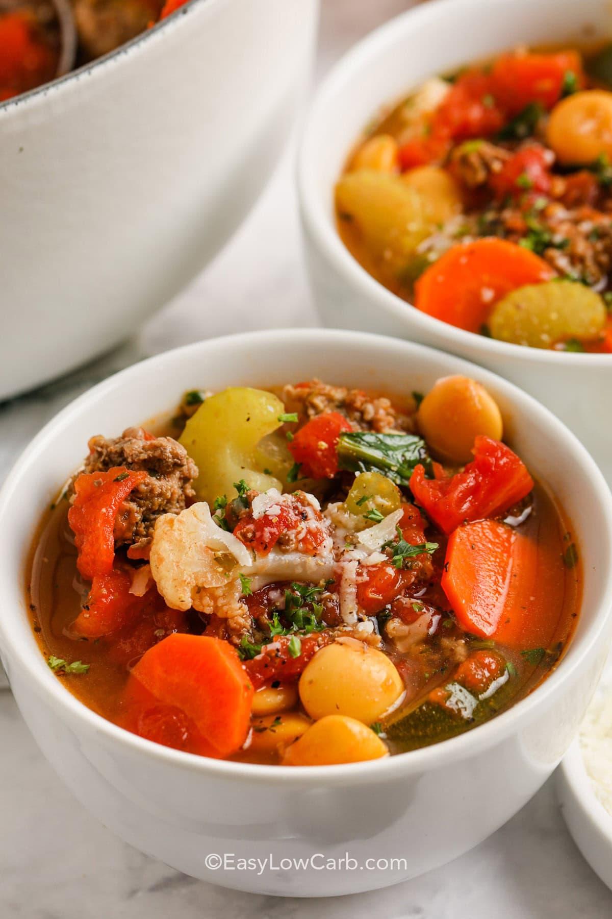 steaming bowl of keto minestrone soup with vegetables