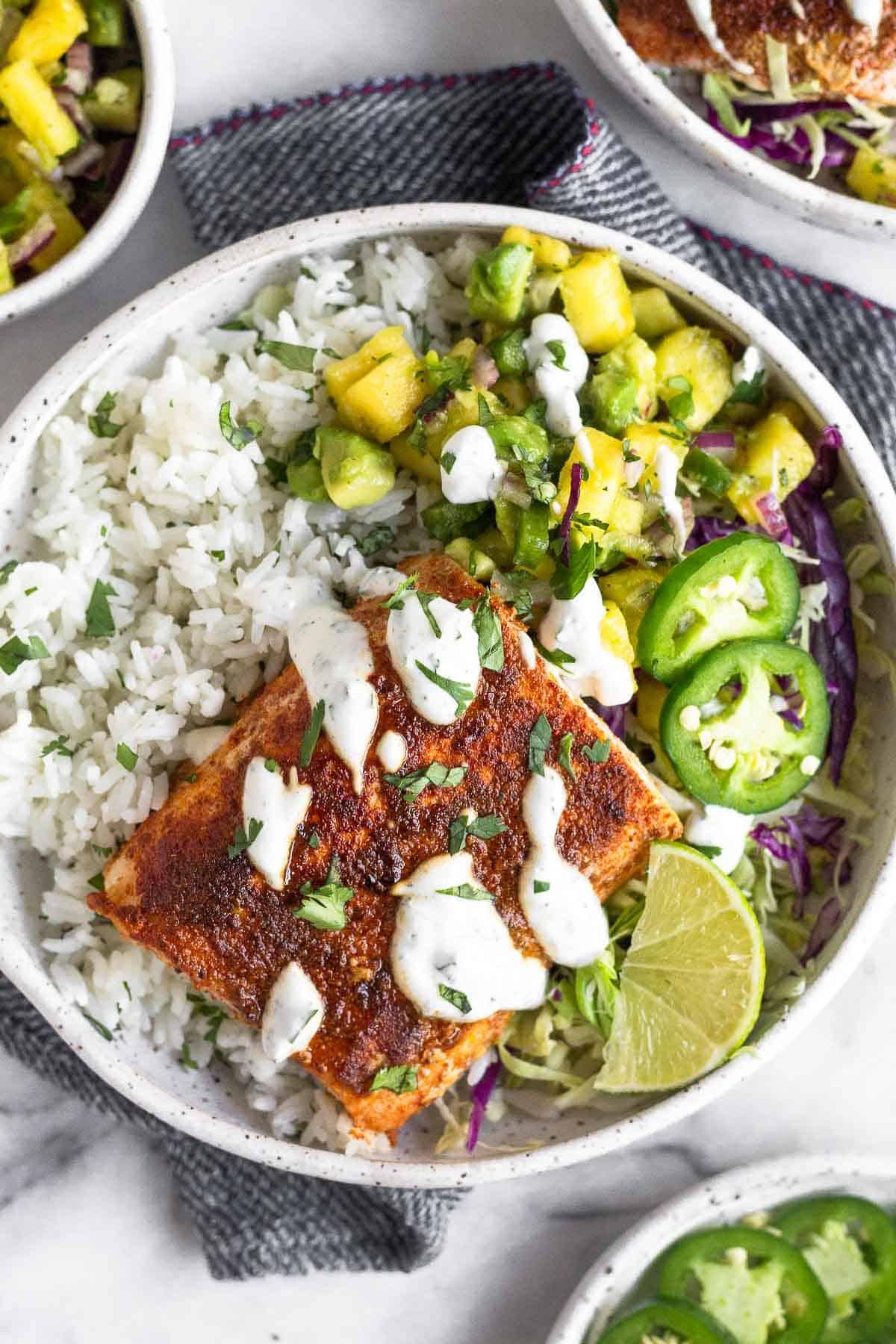blackened fish rice bowl topped with pineapple salsa