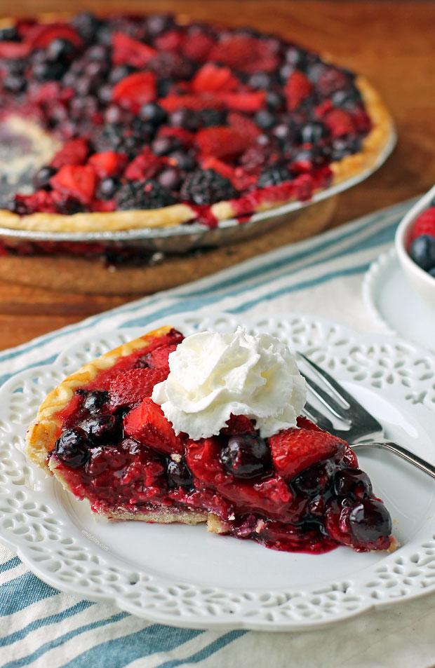 berry pie baking in oven