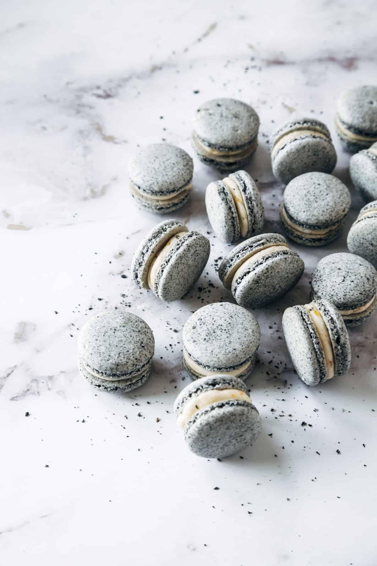 Kimchi macarons with black sesame filling on a white background