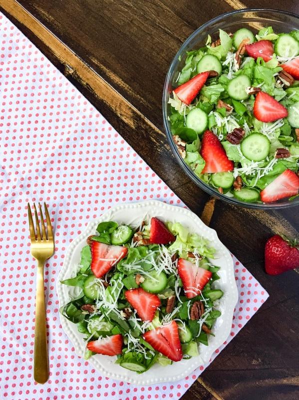 close up of a vibrant spring strawberry salad with lemon vinaigrette