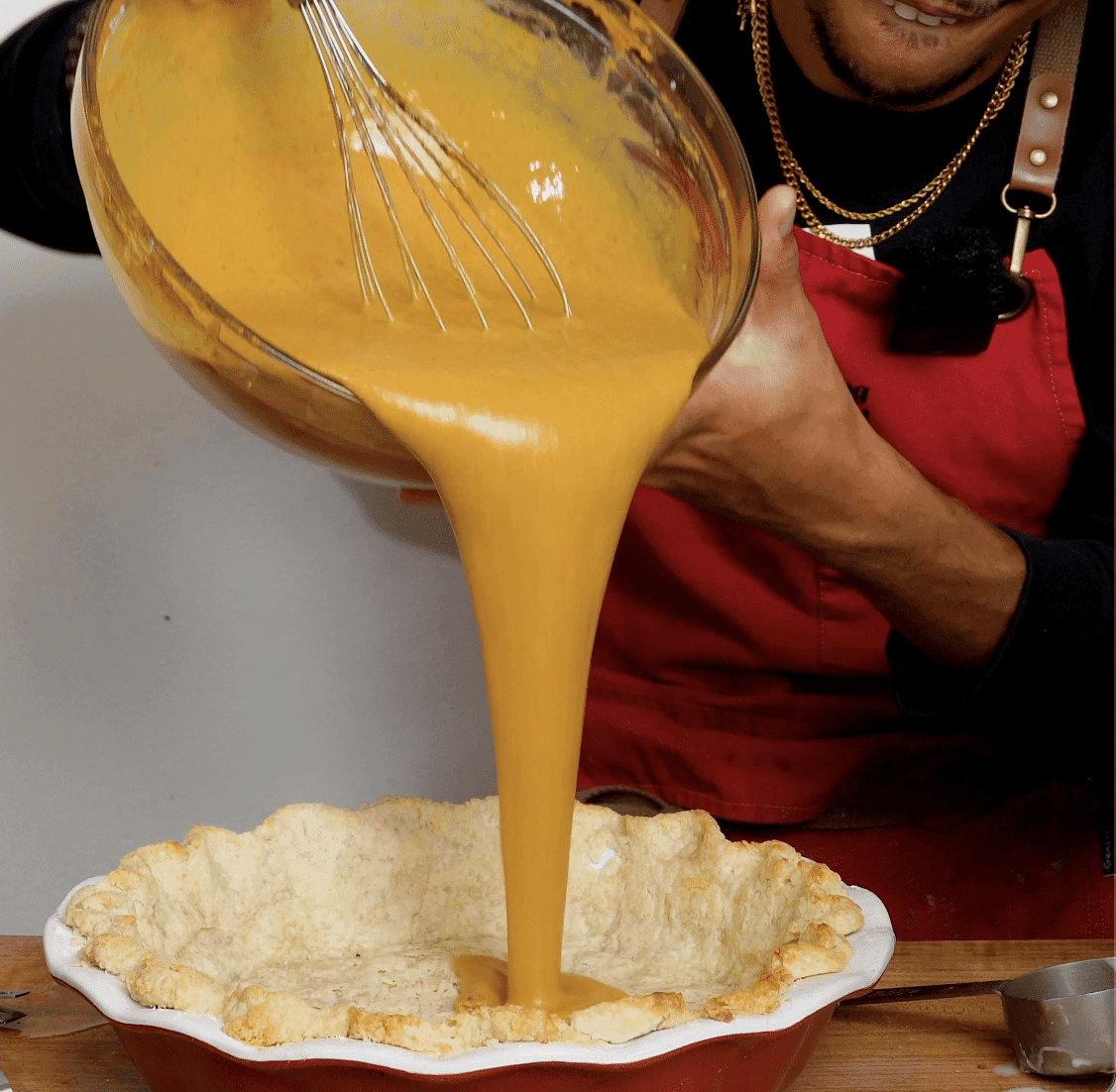 Close-up of creamy pumpkin pie filling before baking