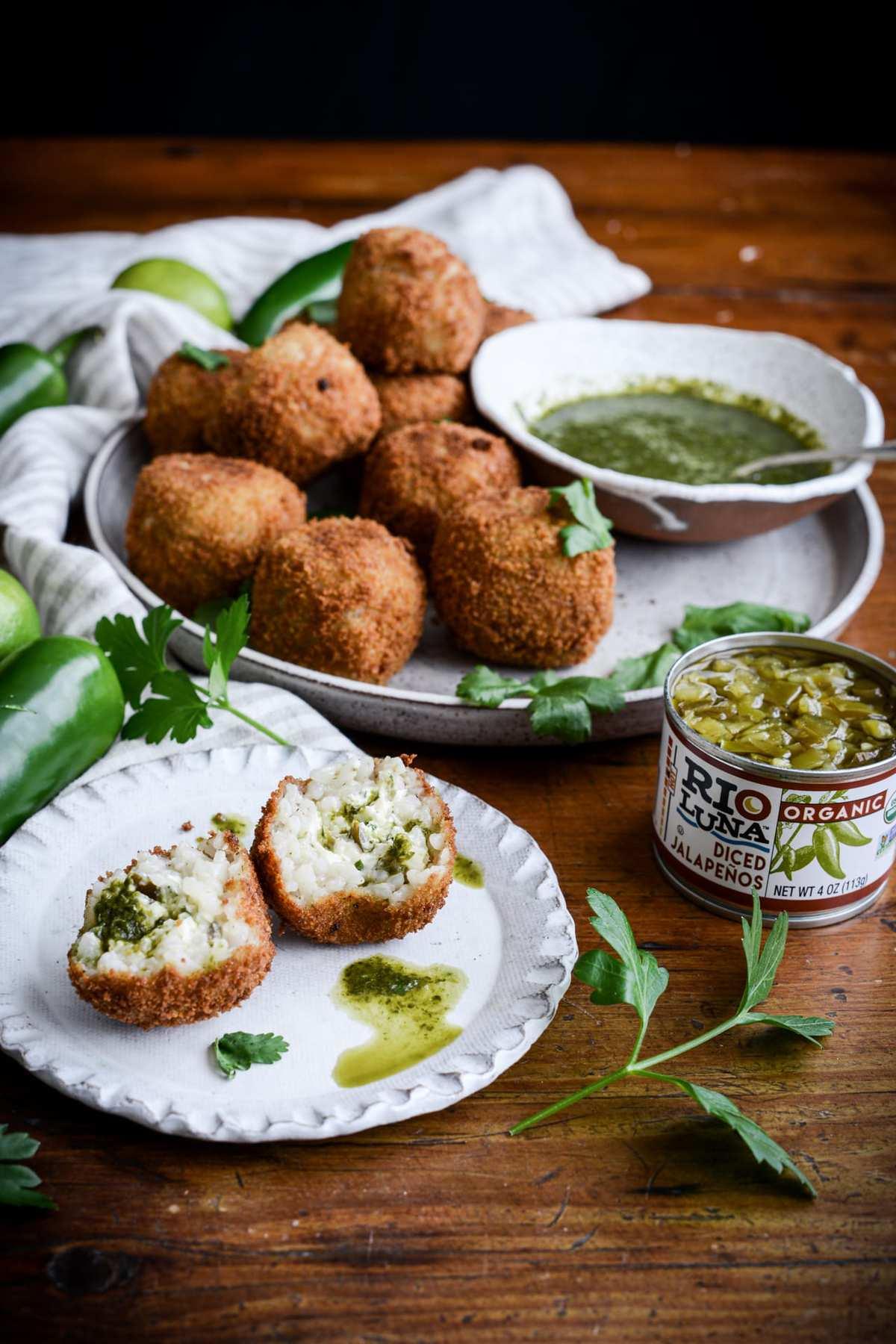 jalapeño popper falafel on a plate with dipping sauce