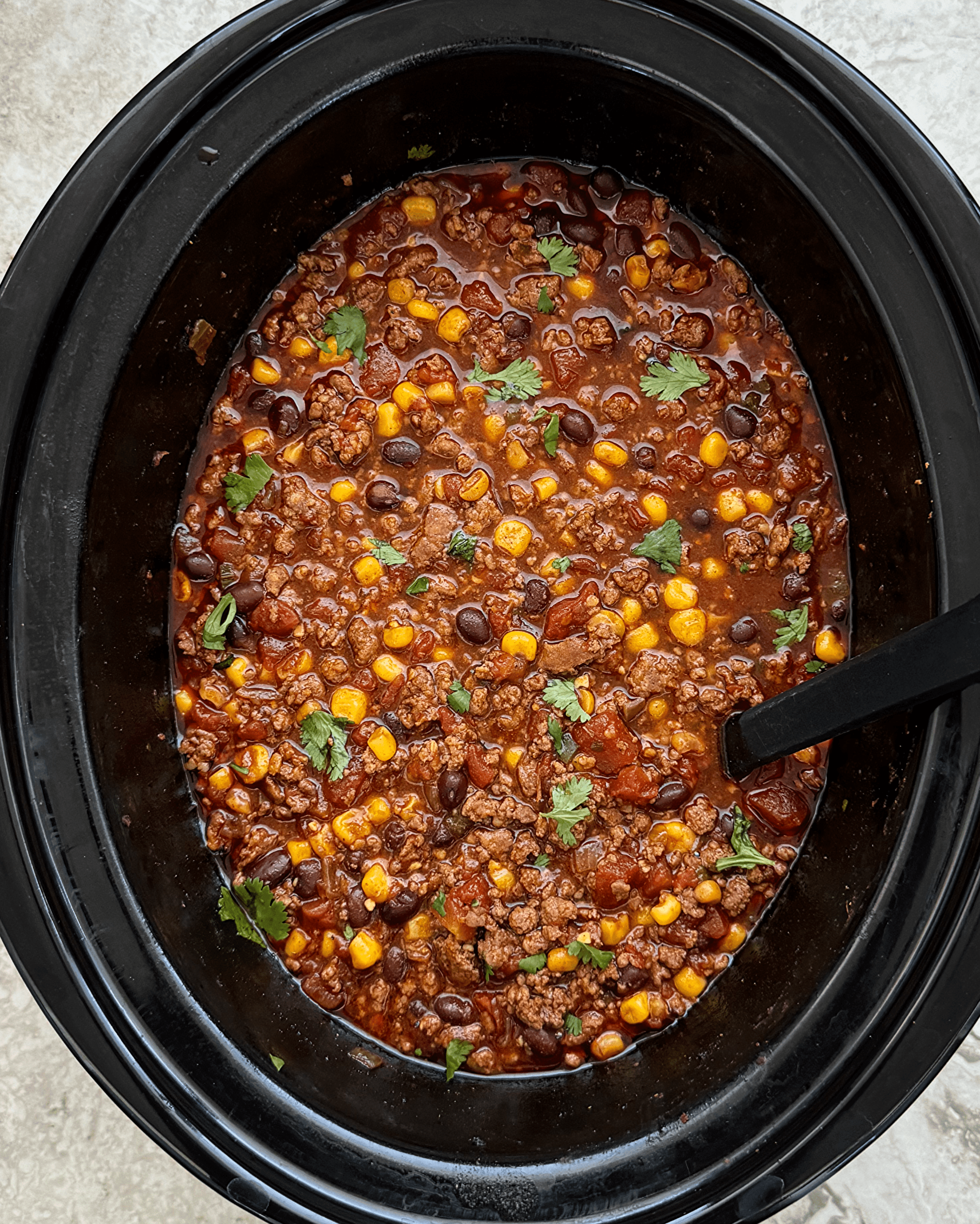 close up view of slow cooker botifarra chili
