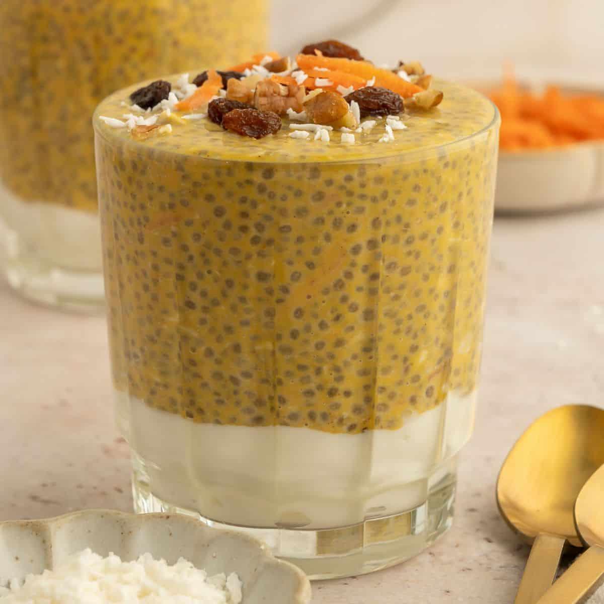 close up shot of carrot greens chia seed pudding in a glass jar