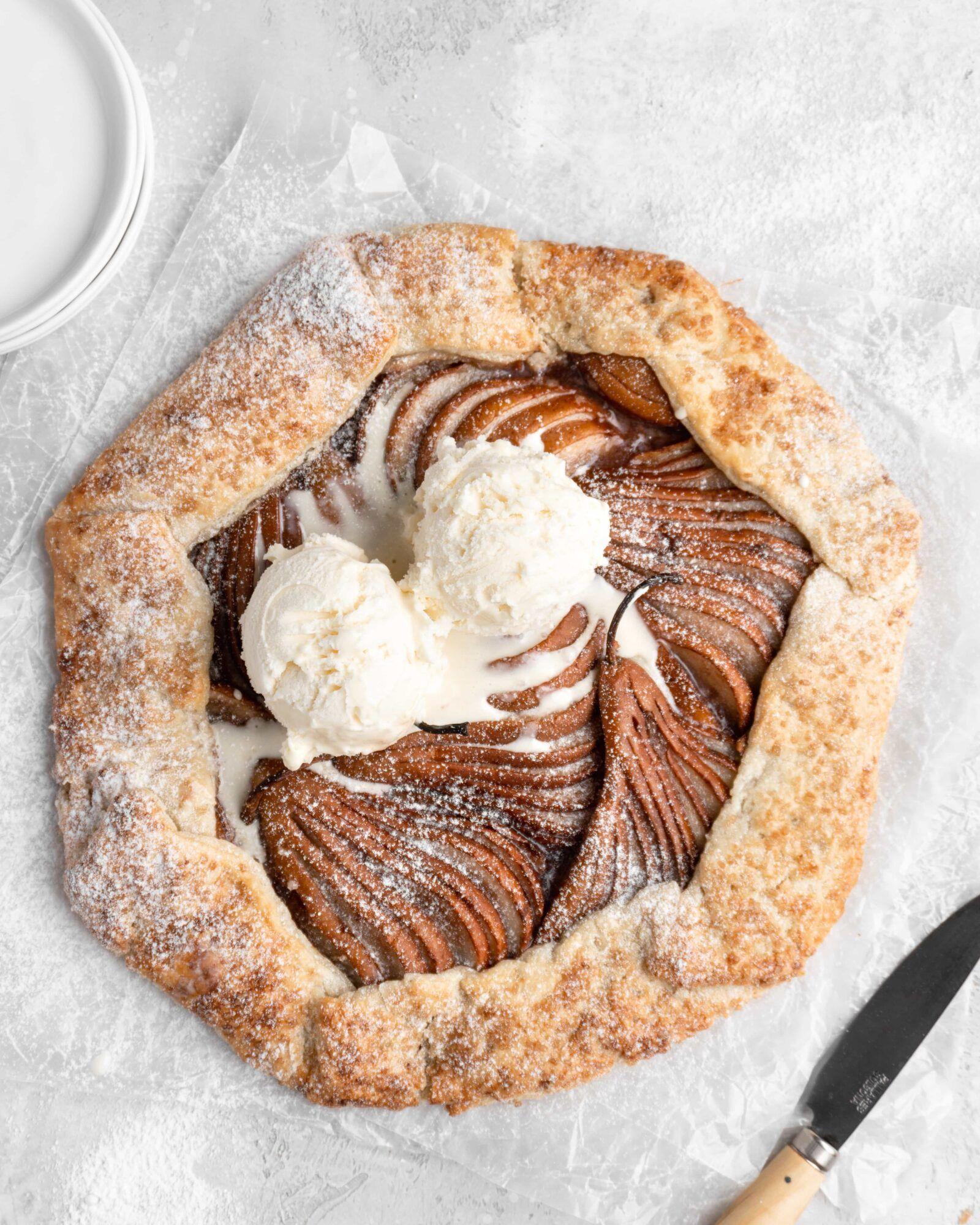rustic spiced pear galette on a wooden board, autumn aesthetic, cozy kitchen