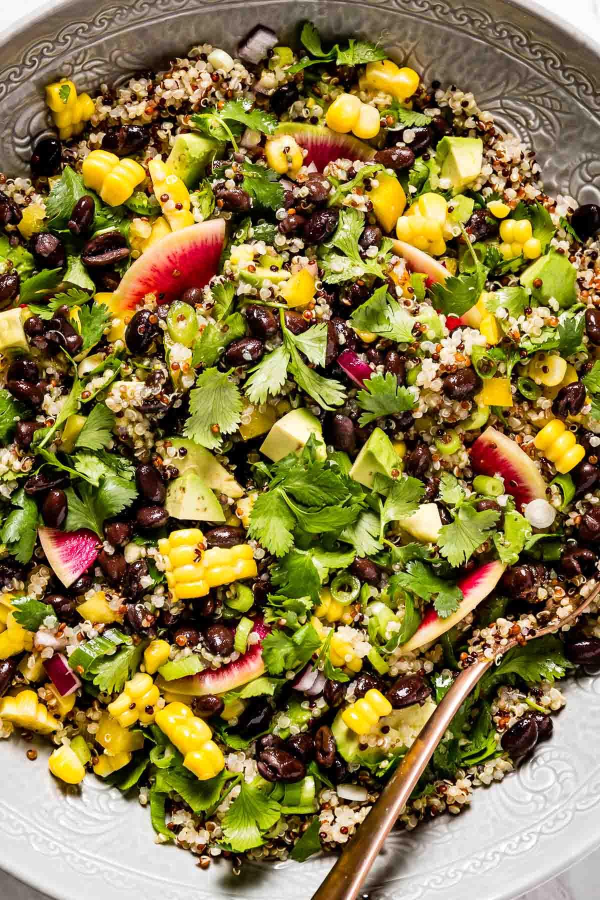 Spicy black bean quinoa salad with avocado and cilantro