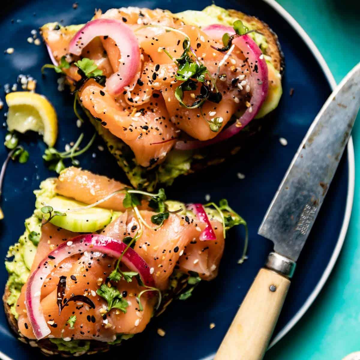 Overhead shot of perfectly assembled smoked salmon and avocado toast