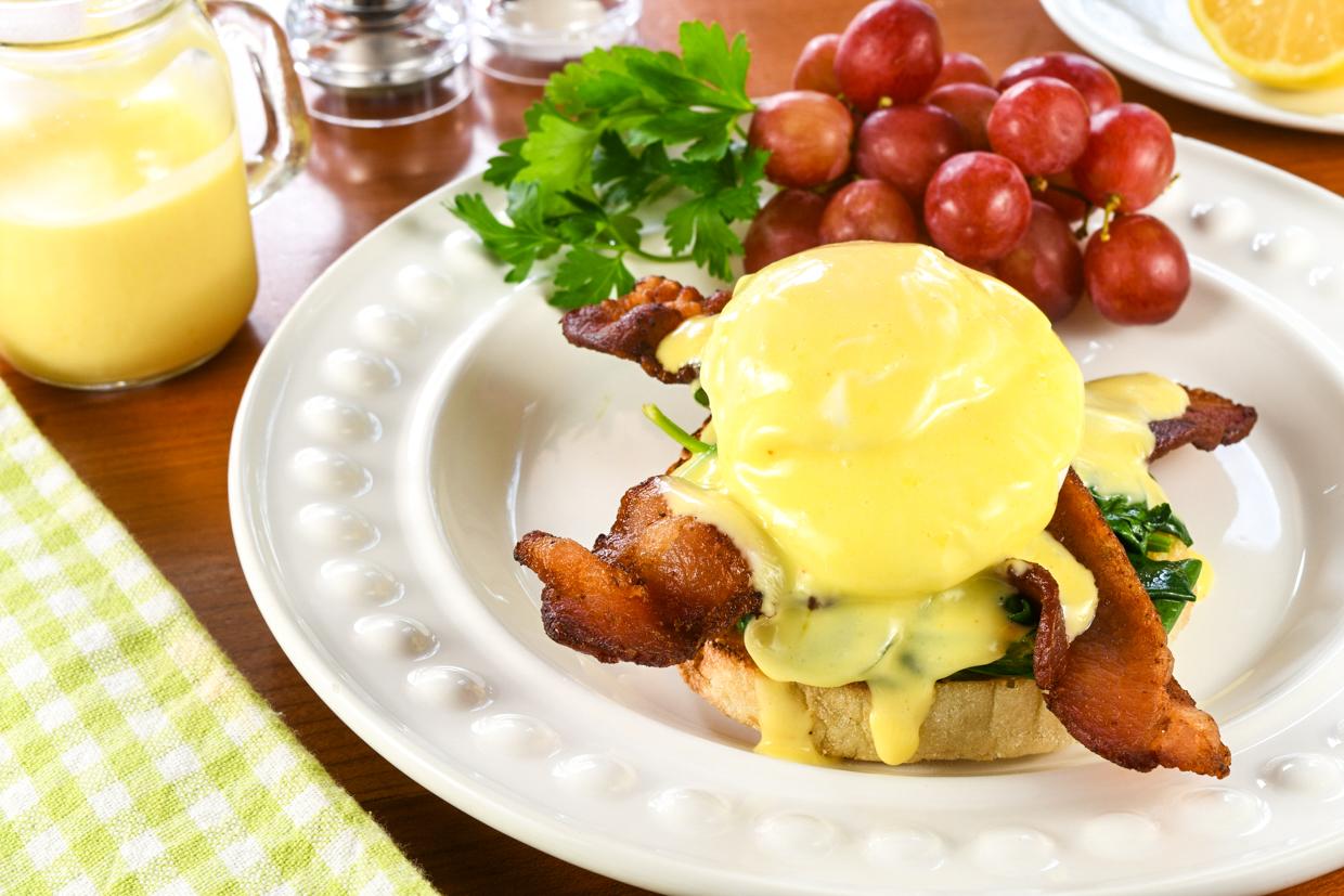 Eggs florentine with bacon wrapped figs drizzled with hollandaise sauce