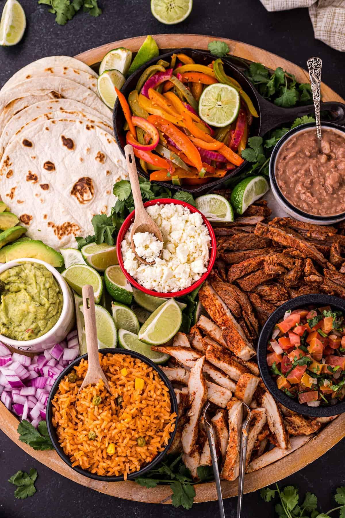 sizzling fajita platter with various toppings